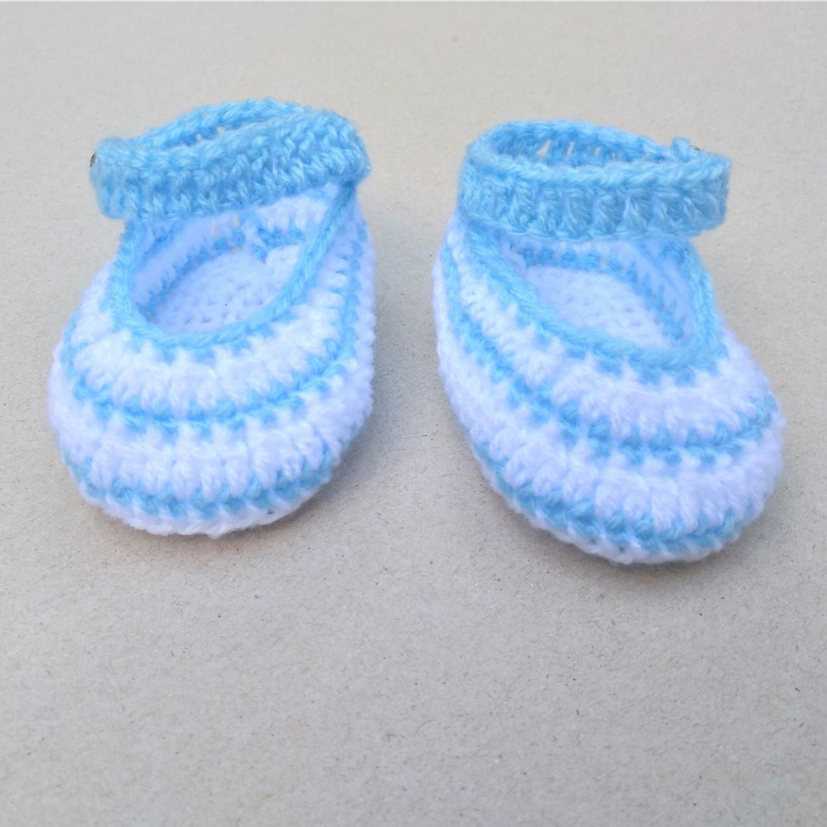 crochet baby shoes with blue and white stripes