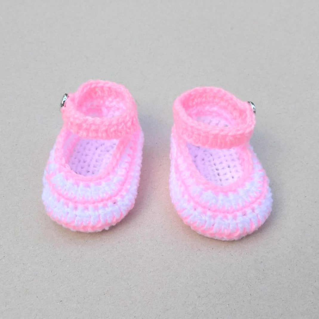 crochet baby booties in light pink and white