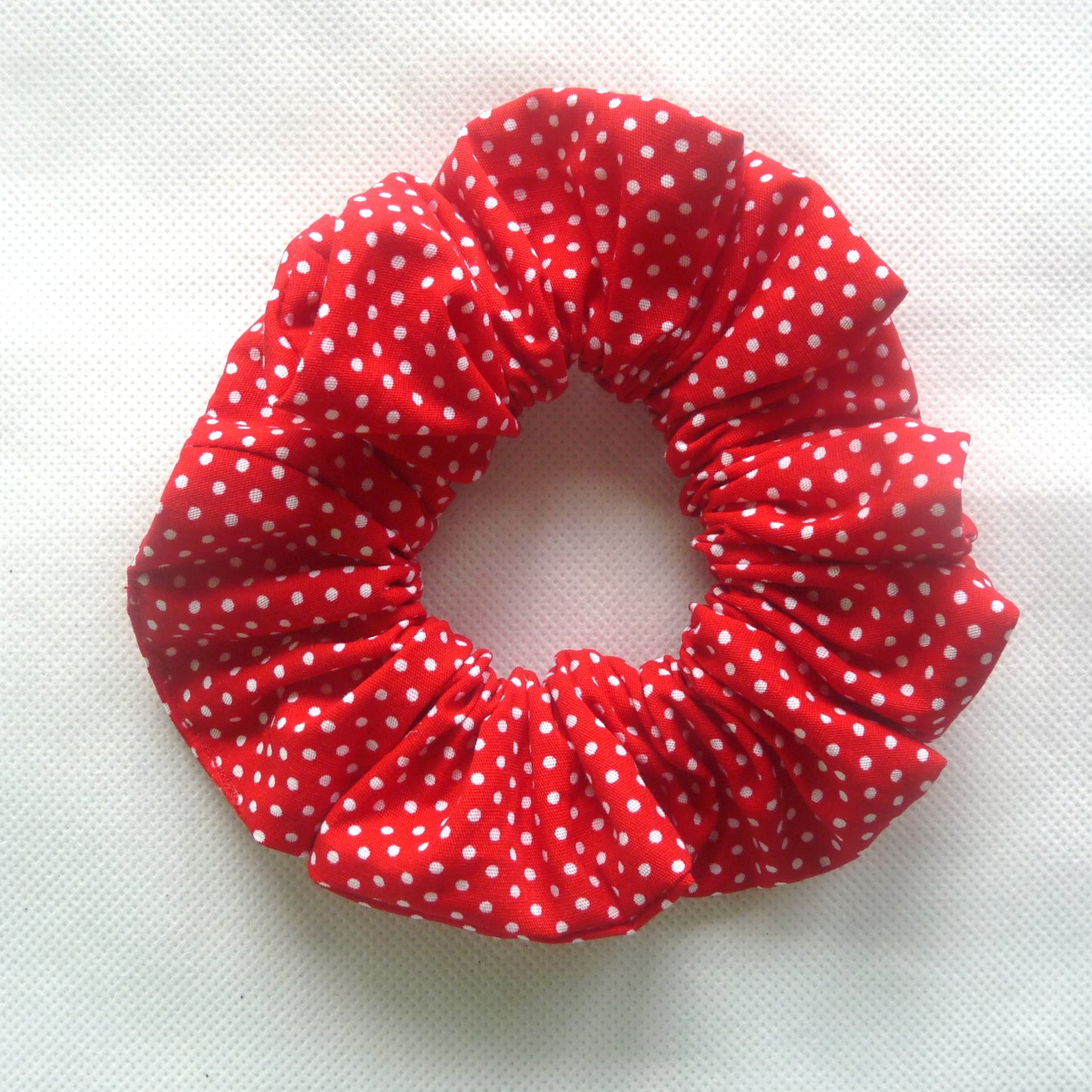 red and white polka dot scrunchie
