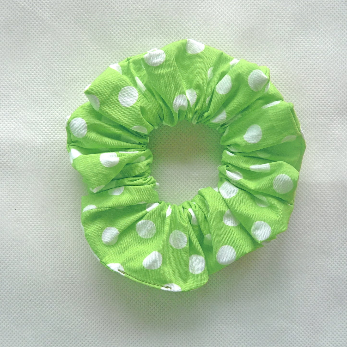lime green and white polka dot scrunchie