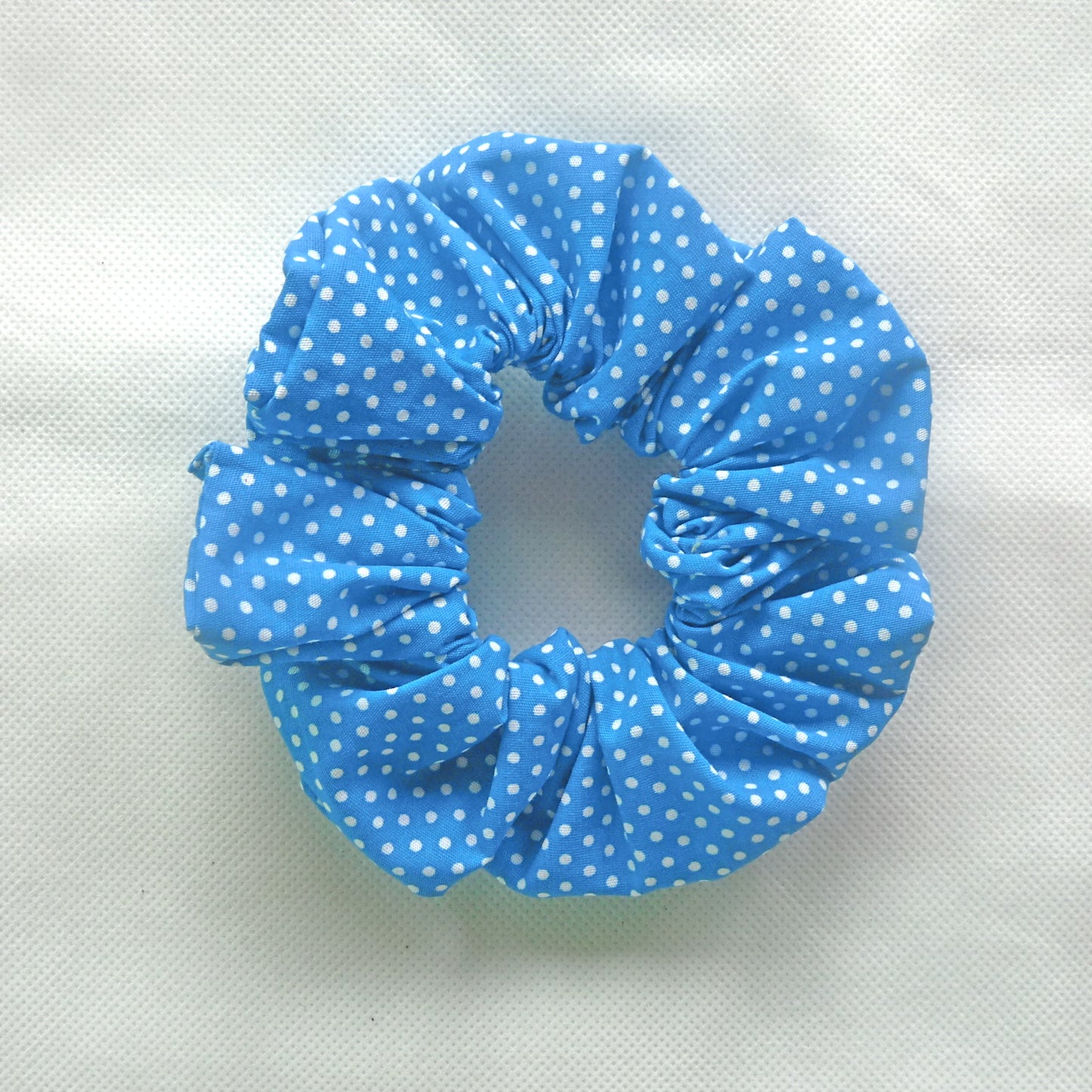 light blue and white polka dot scrunchie