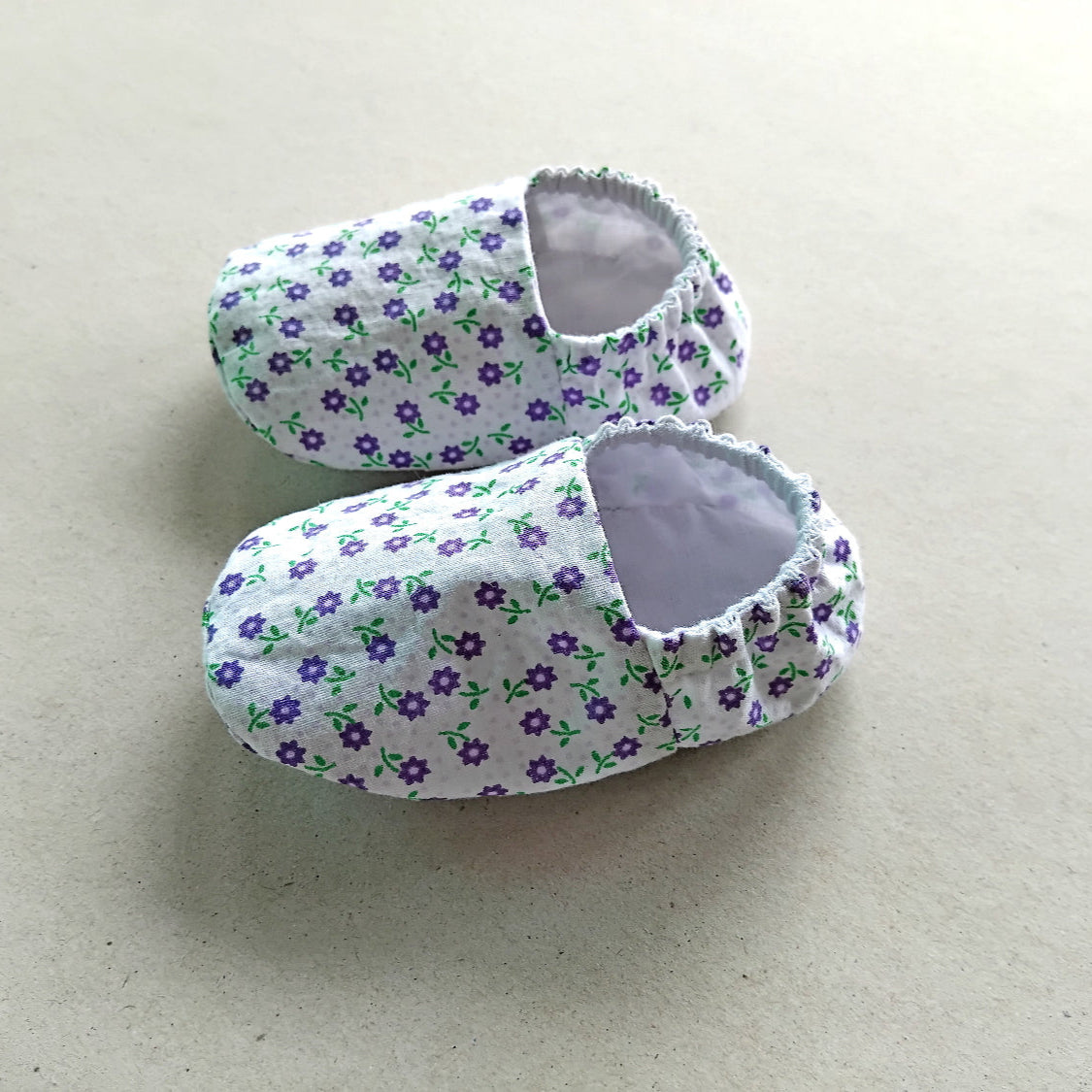 cotton fabric baby shoes, little purple flowers on white background