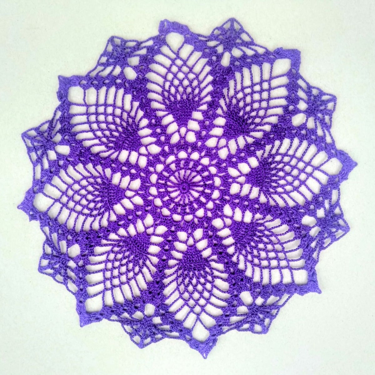 dark purple small round pineapple crochet doily