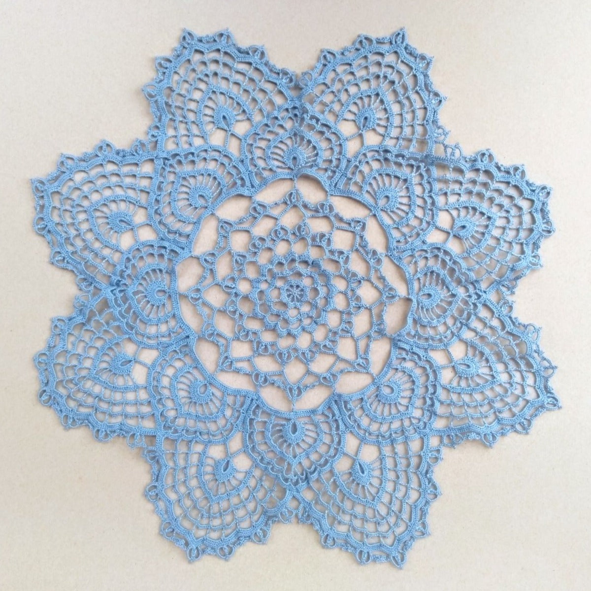 light blue handmade large crochet centrepiece, doily