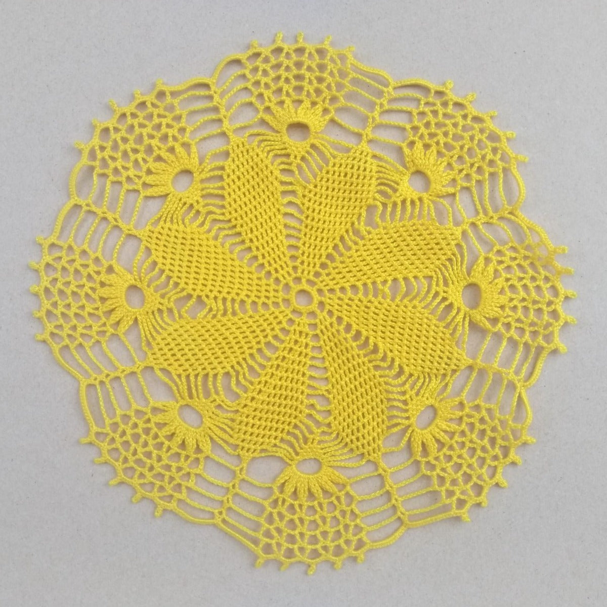 hand crocheted small round yellow doily