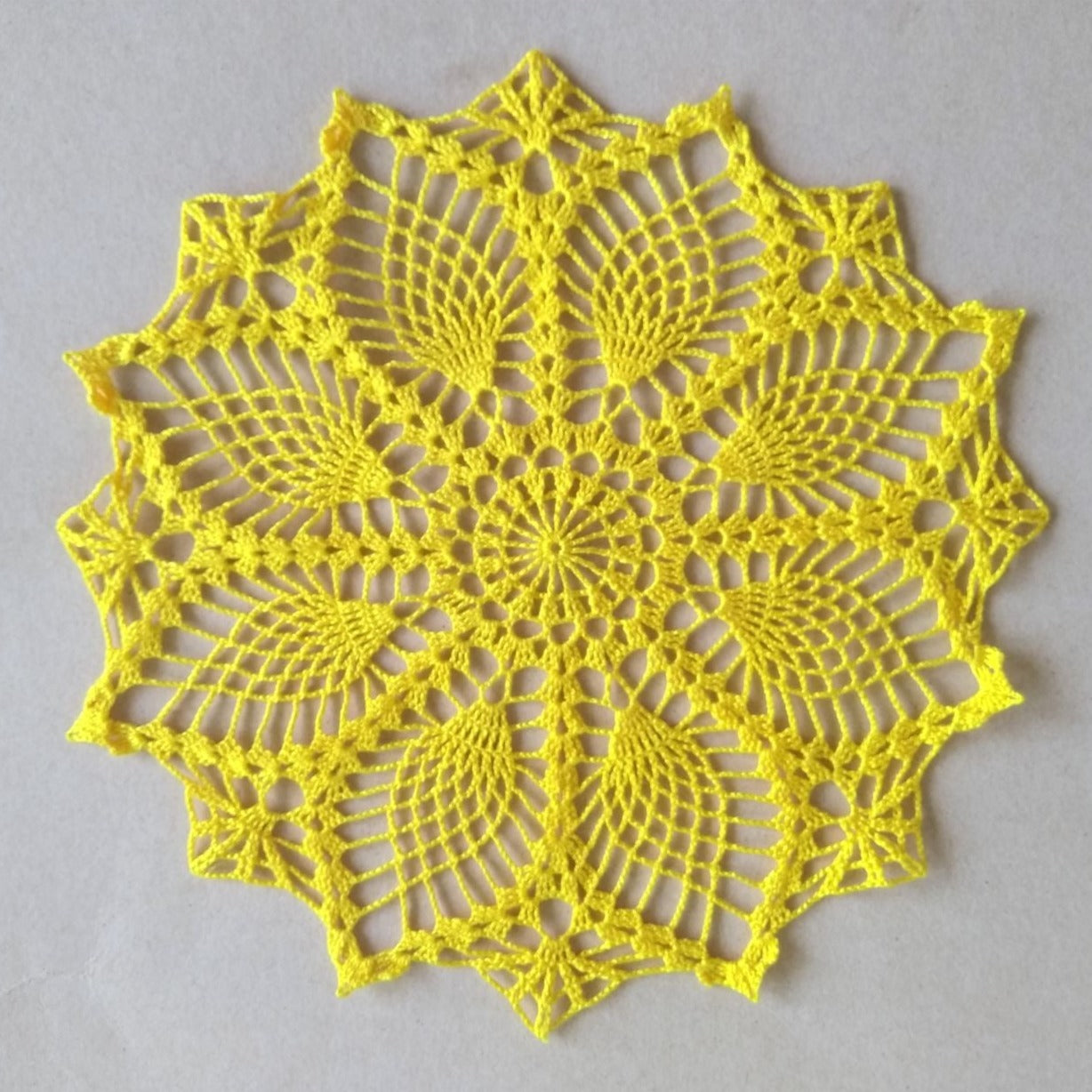 yellow small round pineapple crochet lace doily