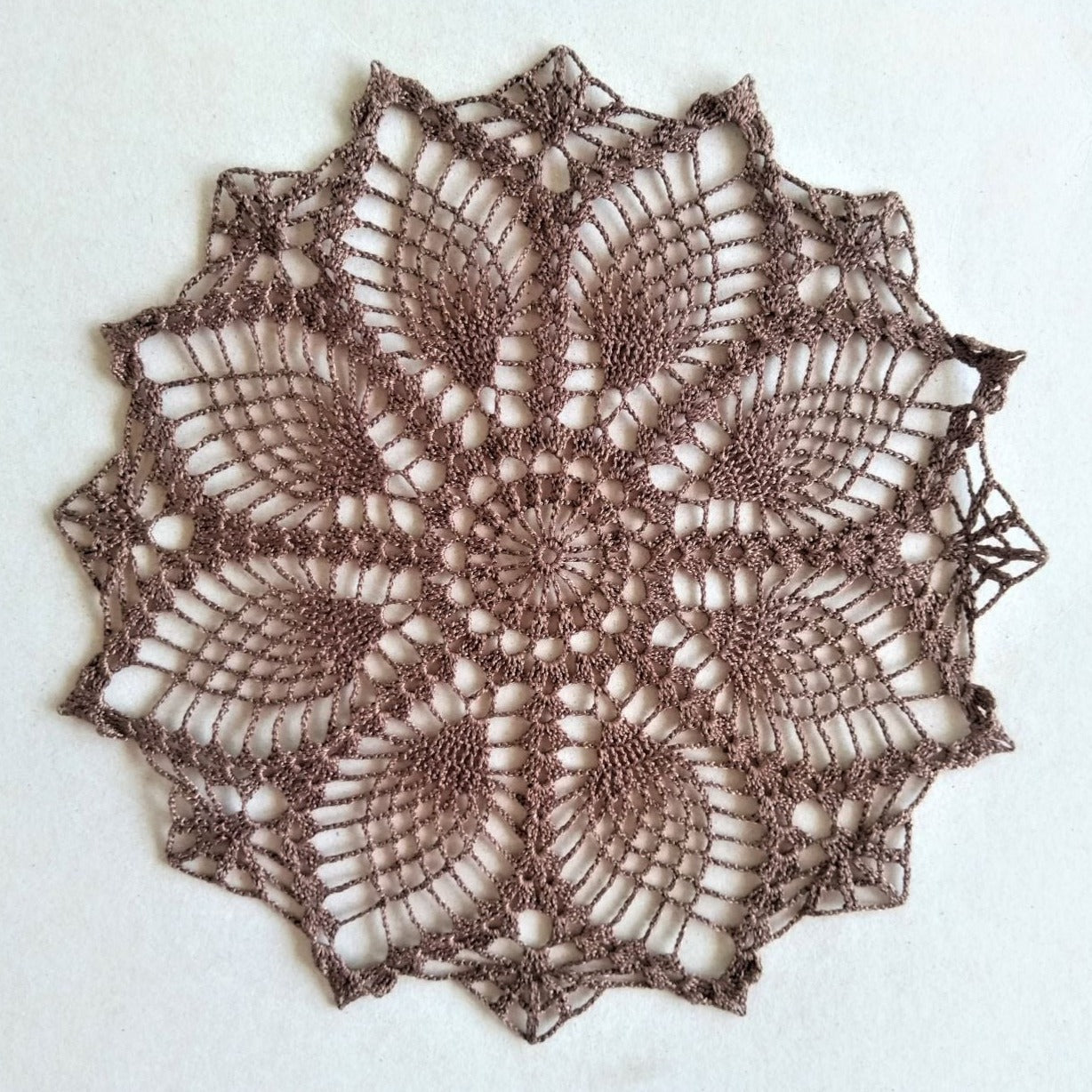 dark brown small round pineapple crochet doily