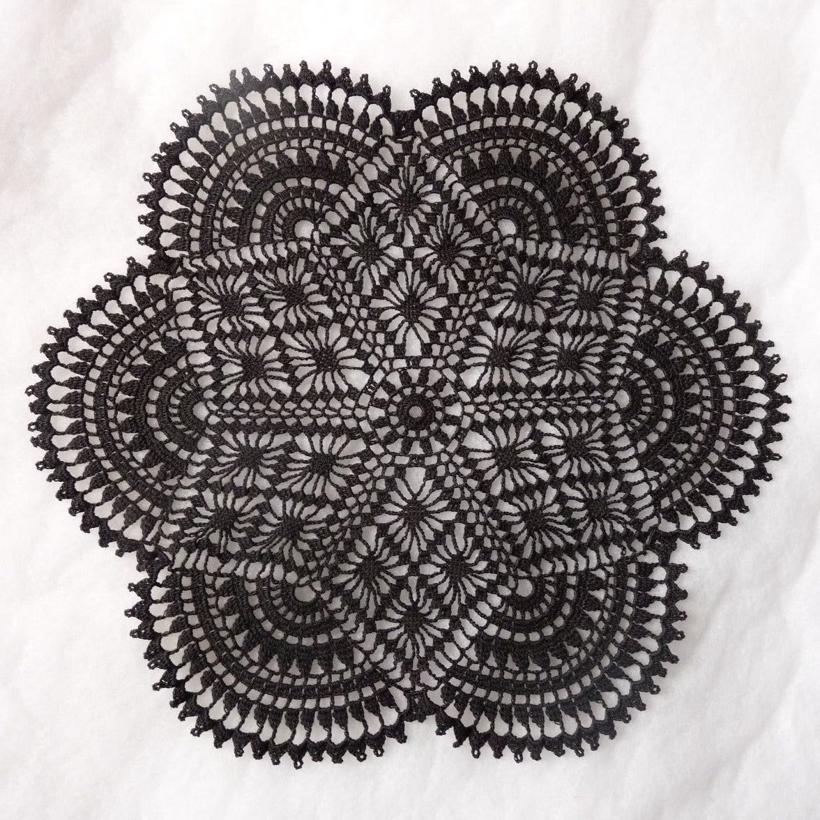 black crochet doily