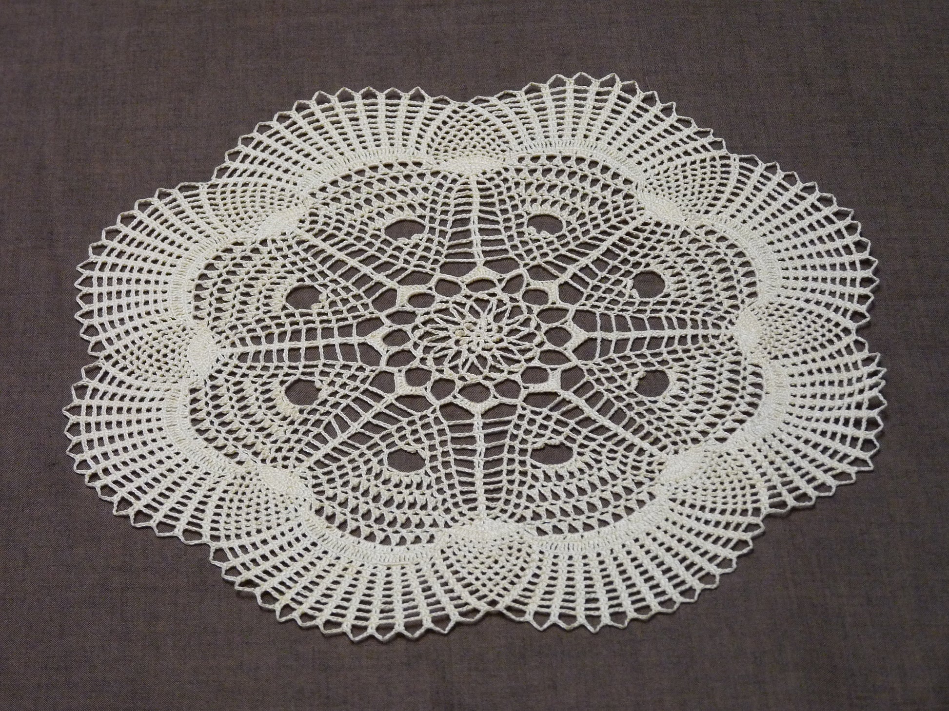 cream flower shaped crochet lace doily