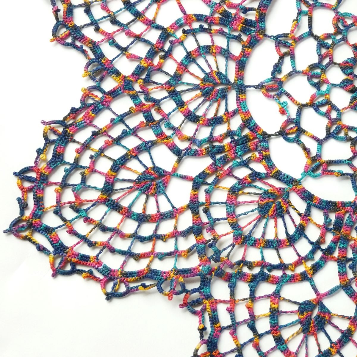 multicoloured large crochet lace doily