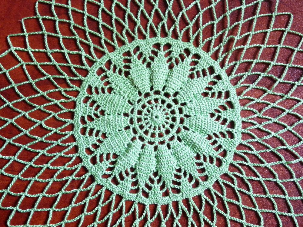 light green handmade small round crochet lace doily