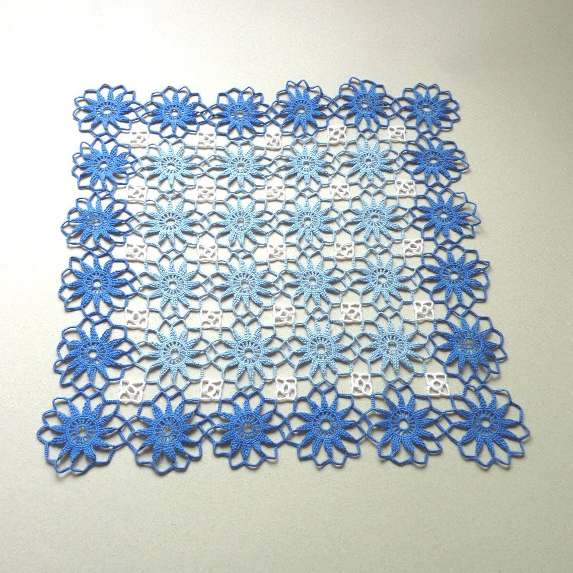 large blue and white square crochet lace centrepiece