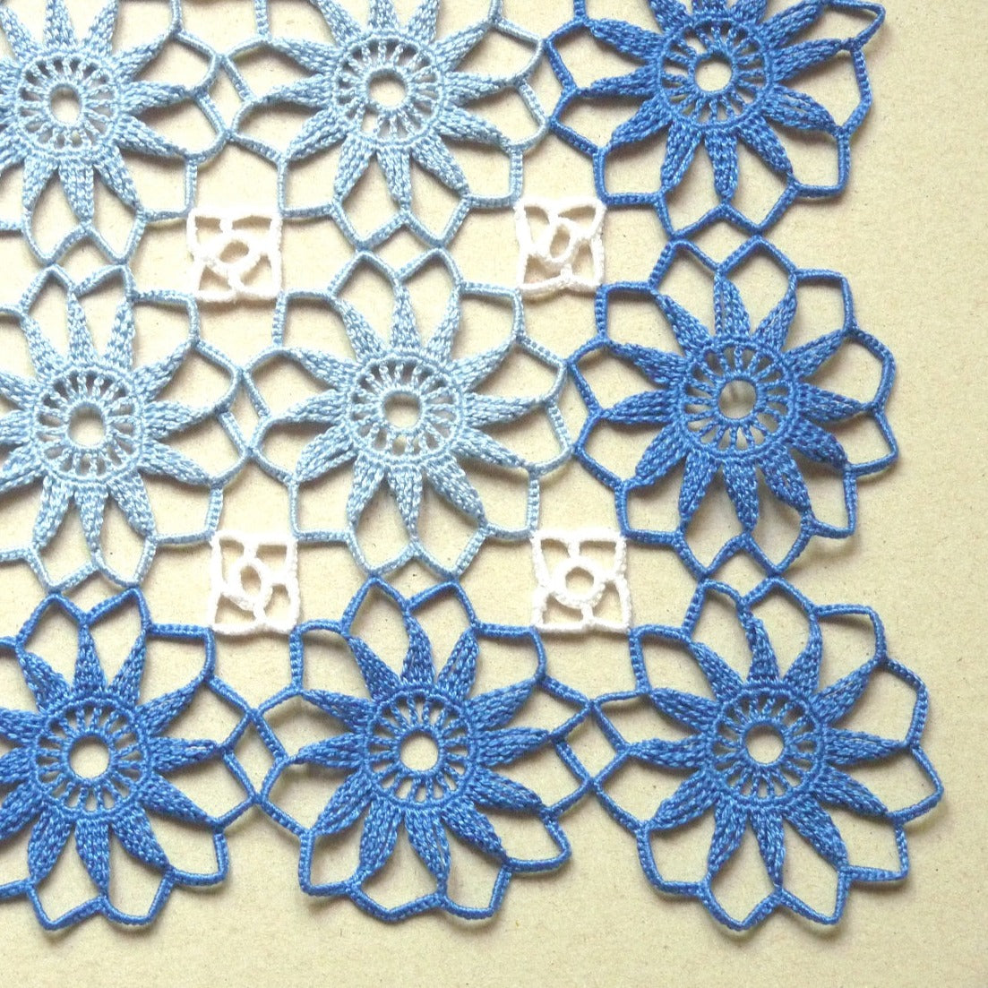 large flower motif blue and white crochet square doily