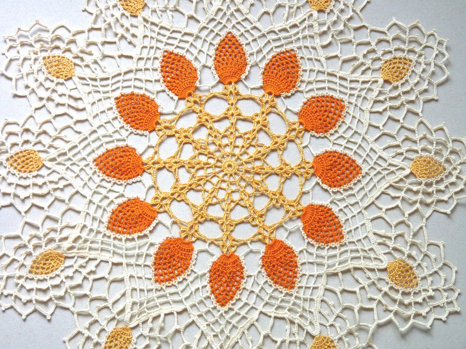 handmade large round pineapple crochet lace doily, orange and cream centrepiece