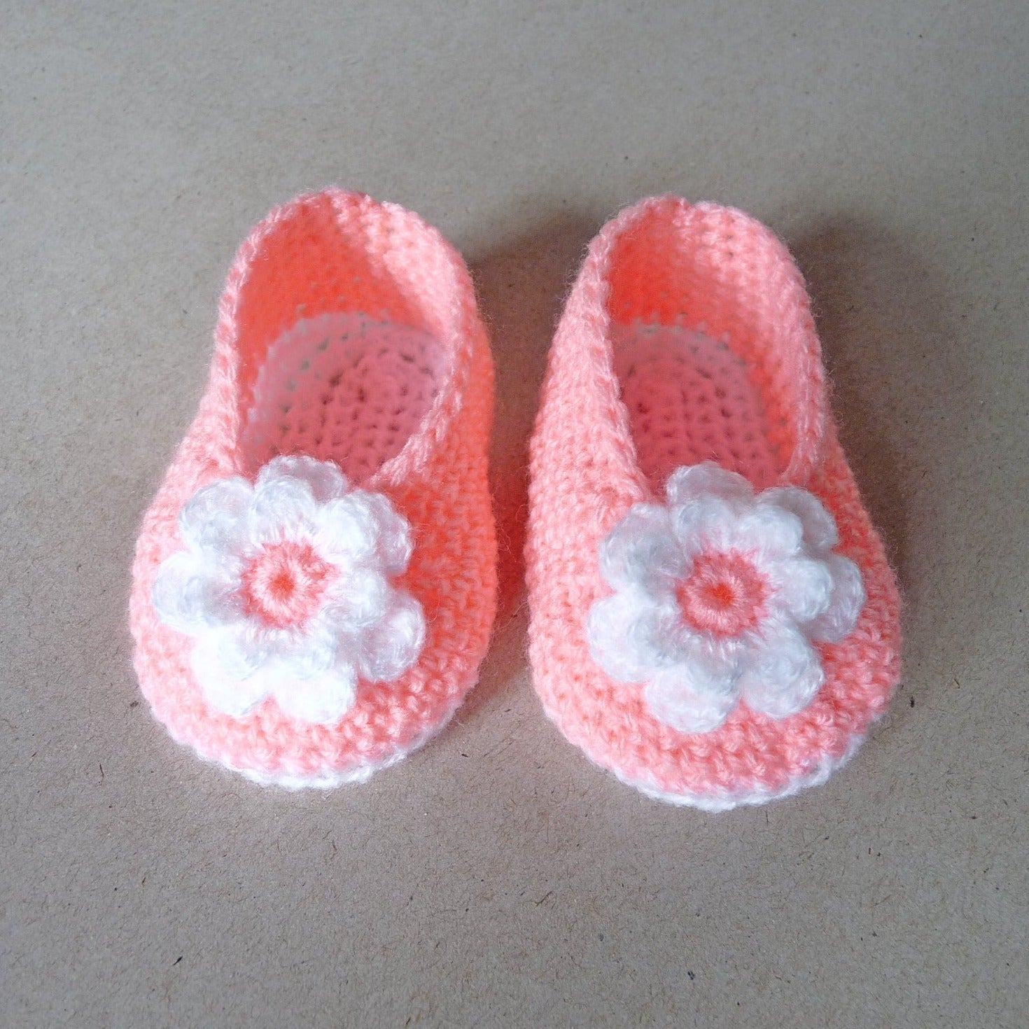 peach crochet baby shoes with large flower