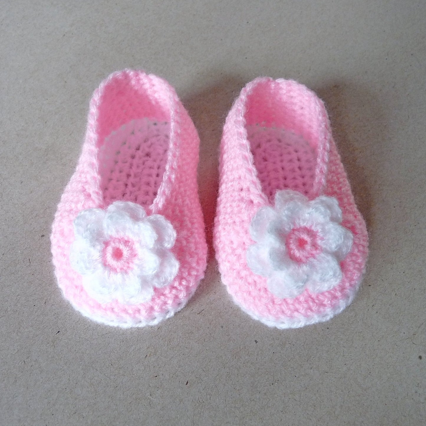 light pink crochet baby shoes with large flower for baby girls