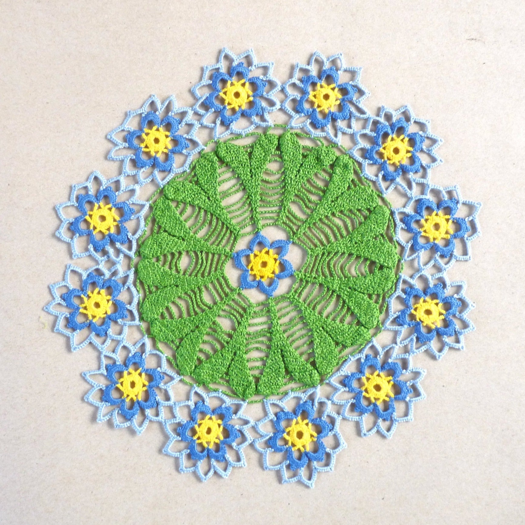 Handmade blue flower small round crochet lace doily