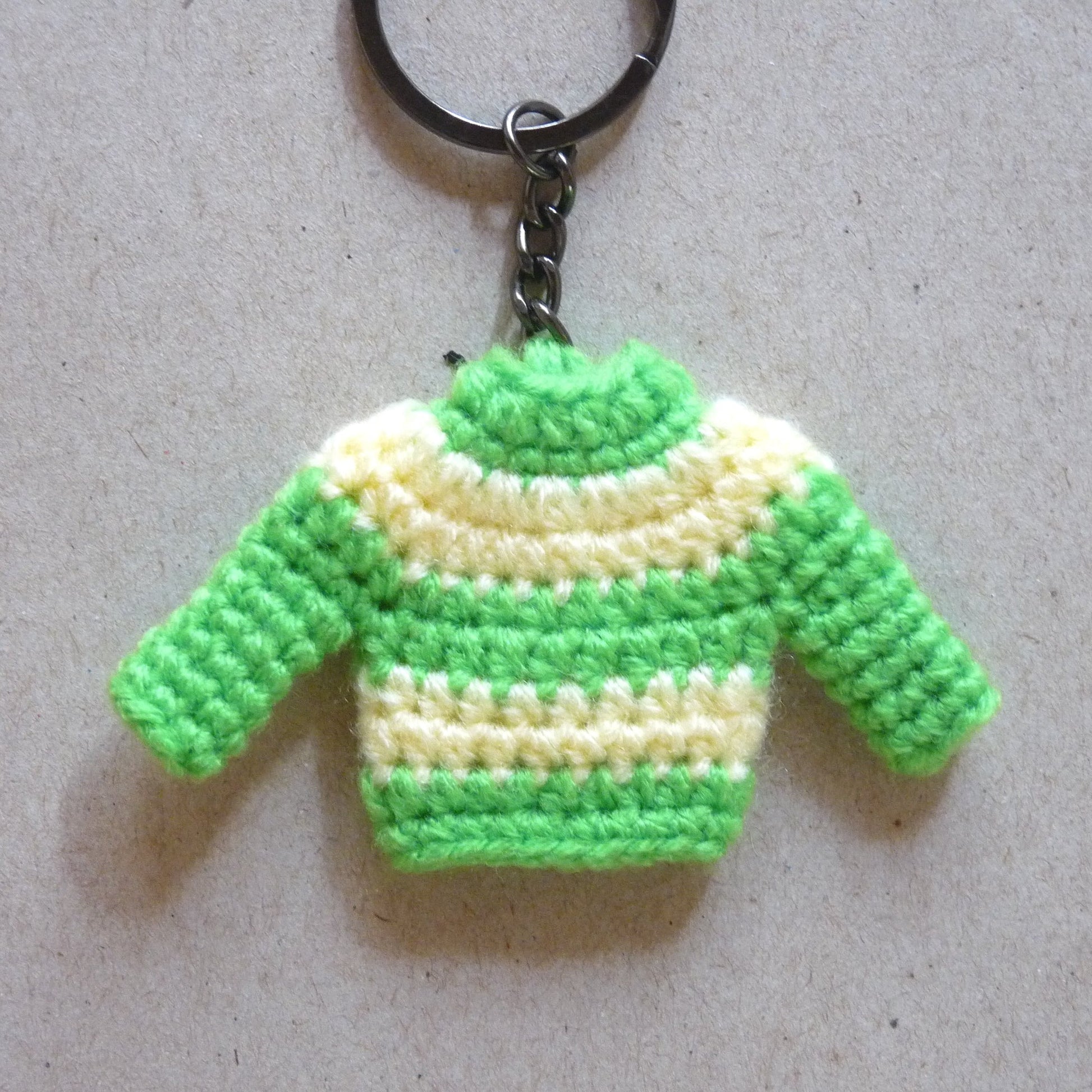 green and yellow crochet sweater key tag