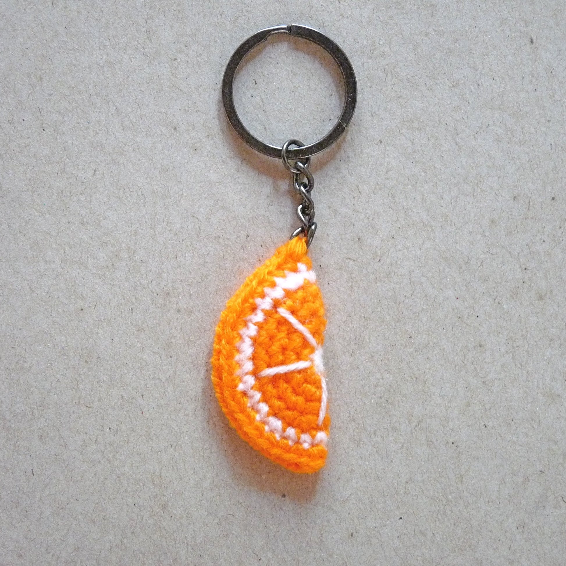 half an orange slice amigurumi keychain