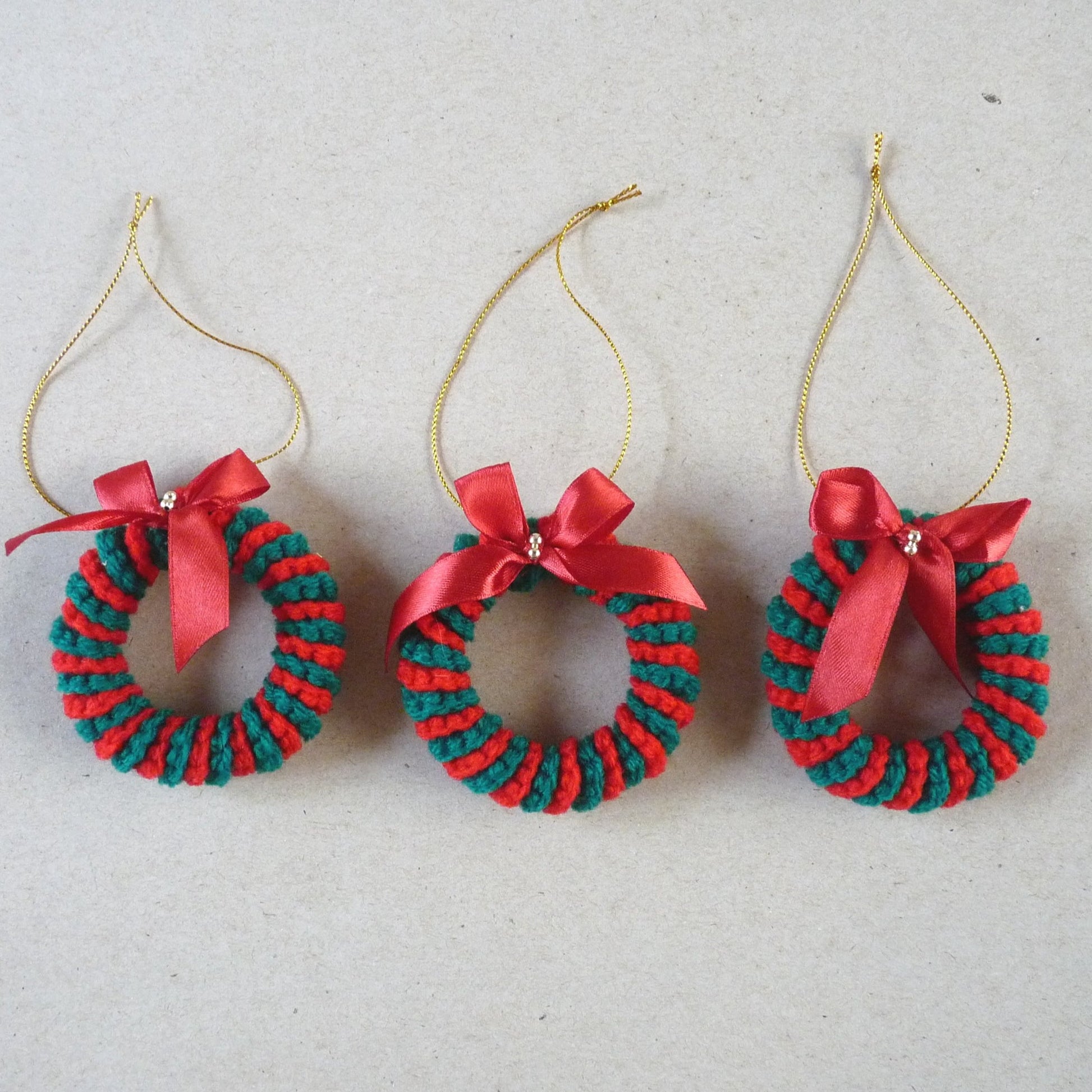 red and green crochet candy cane Christmas tree ornaments, set of 3