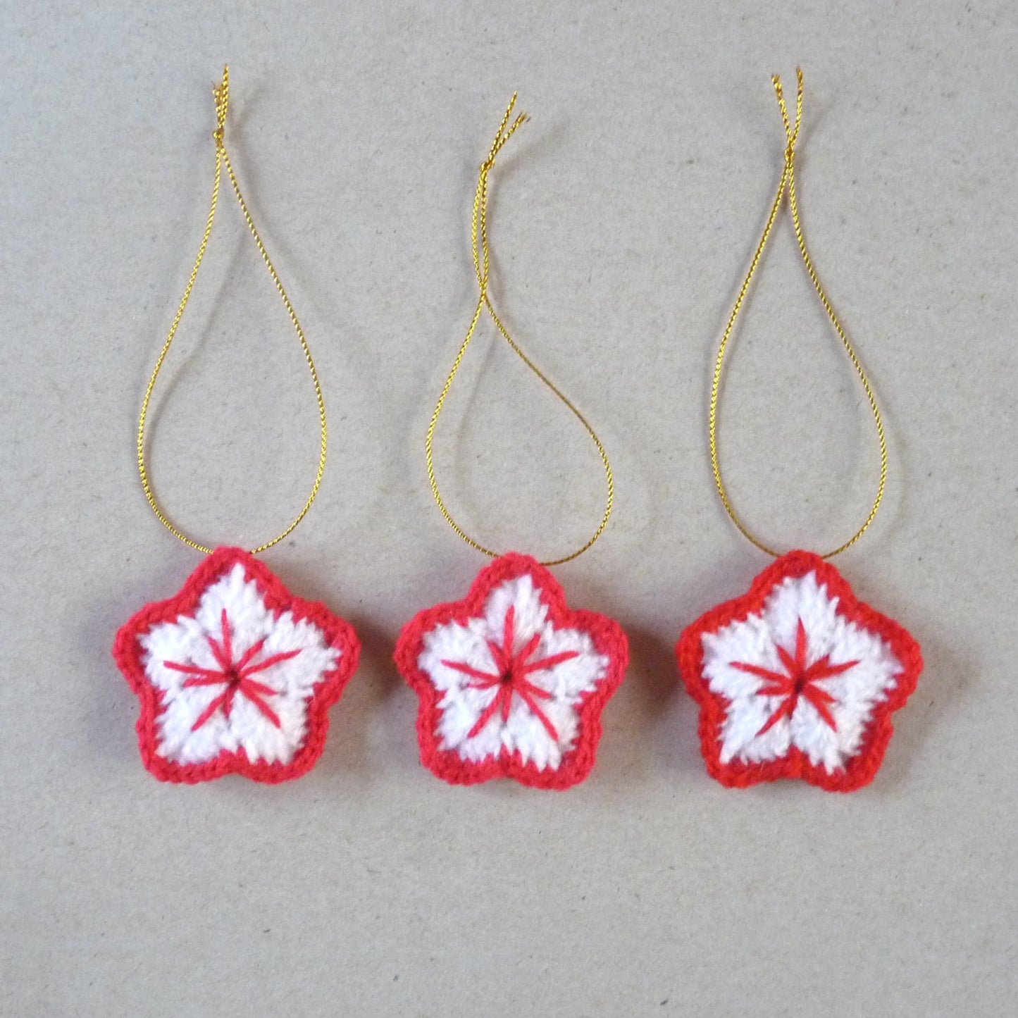 red and white Christmas tree crochet ornaments, set of 3