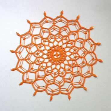 orange round crochet lace doily, centrepiece