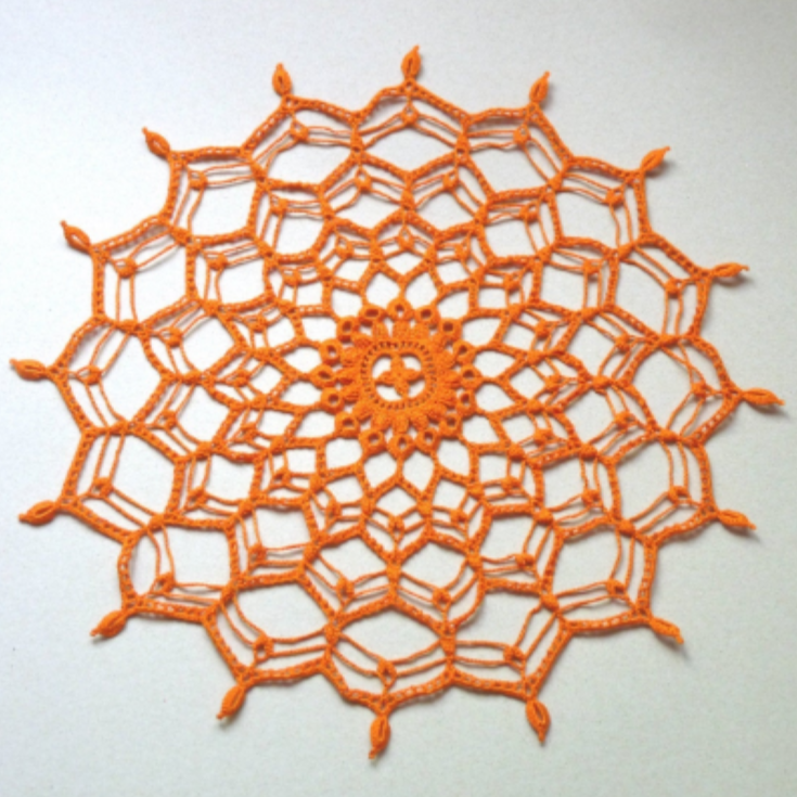 orange round handmade crochet doily