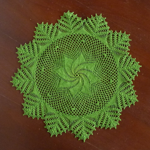 dark green crochet lace round doily