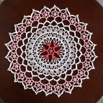 pink and white large round floral crochet lace doily