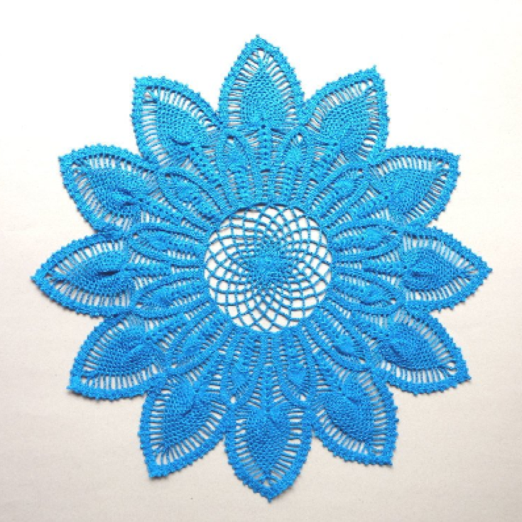 Large blue flower shaped crochet doily