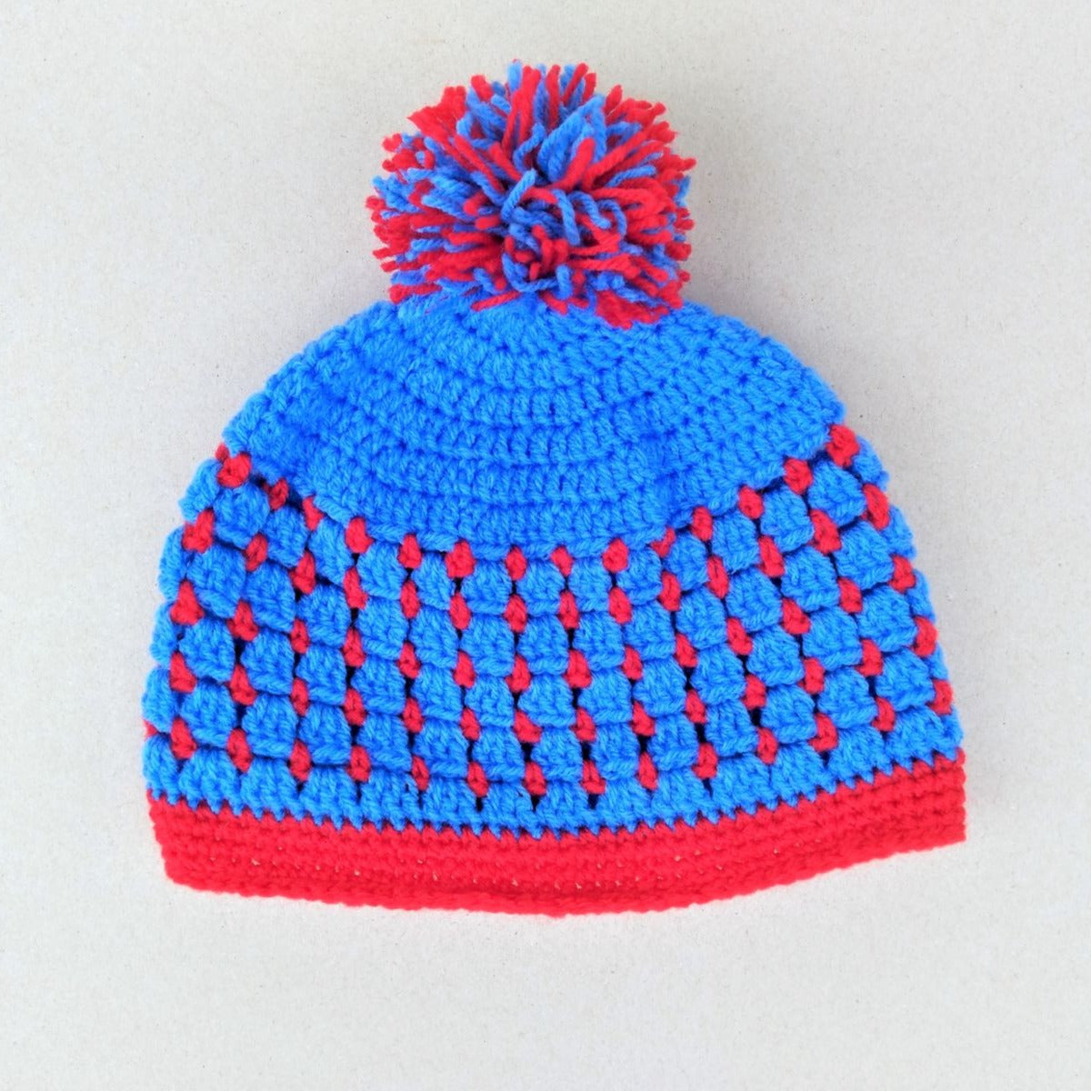 red and blue crochet baby hat and booties set