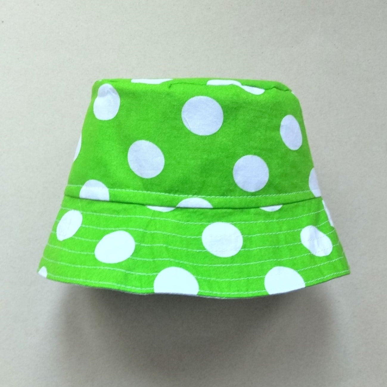 lime green and white dot reversible cotton fabric baby bucket hat