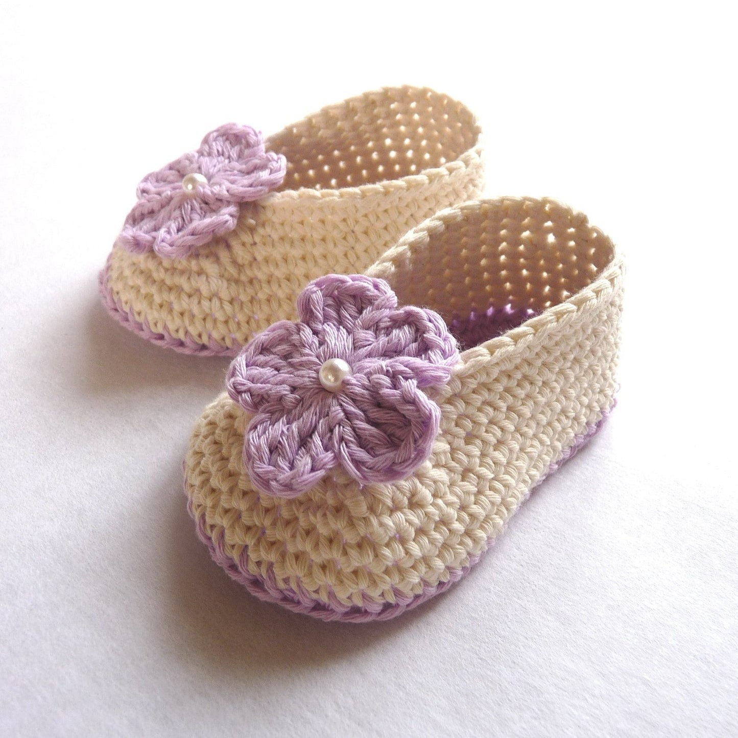 handmade crochet baby shoes with flowers, lilac and off-white