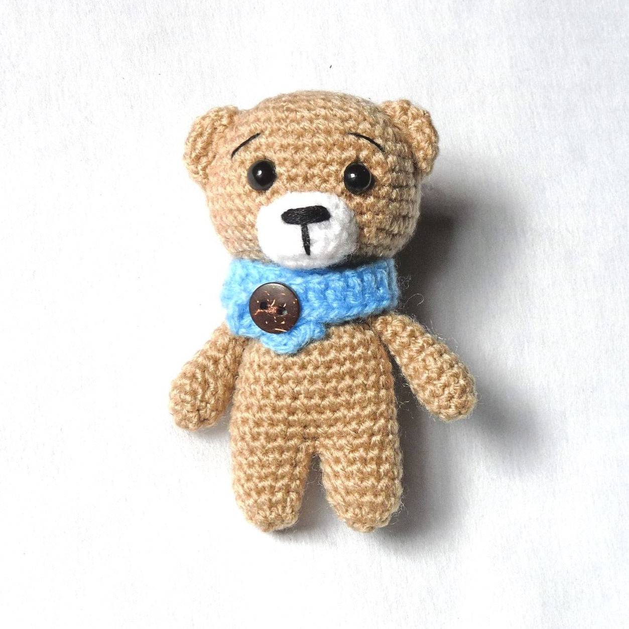 tiny crochet bear measuring 3.5" (9cm)