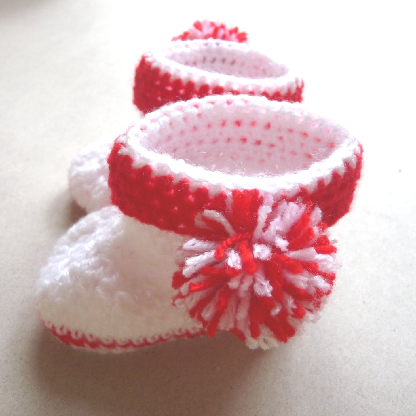 red and white crochet baby shoes