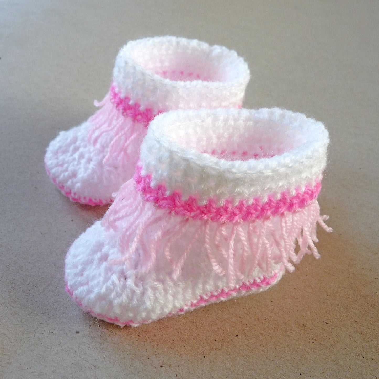 white and pink crochet baby shoes/ booties with fringe