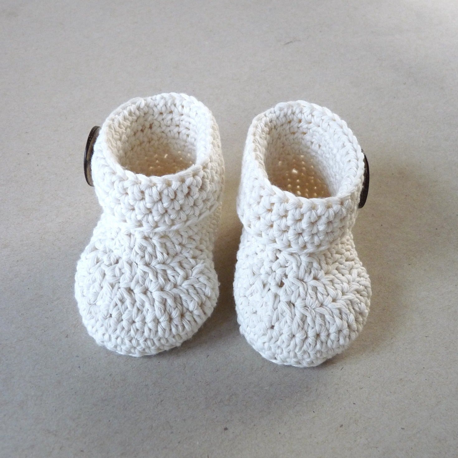 handmade crochet off white baby shoes with wooden buttons