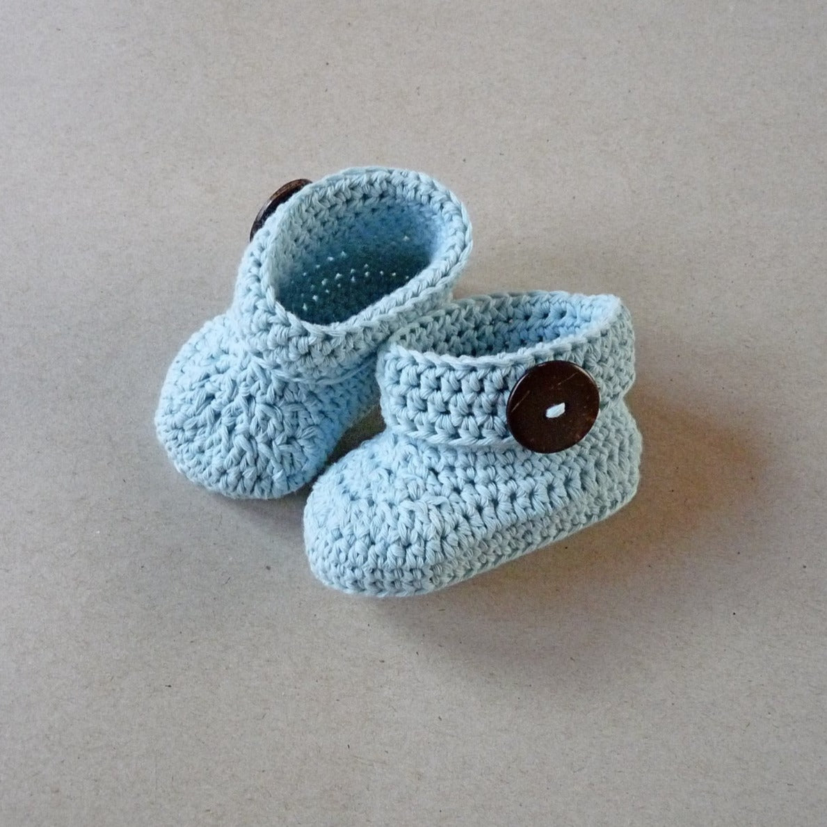 mint blue crochet baby shoes with coconut shell buttons