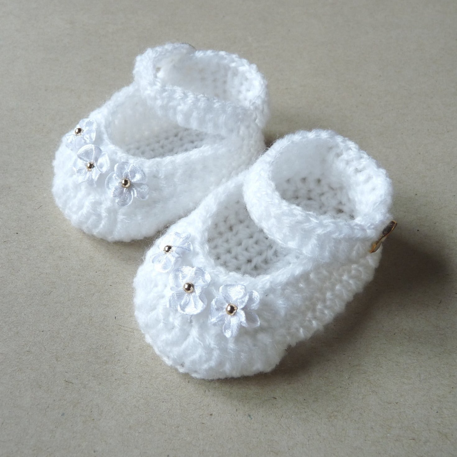 white crochet baby shoes/ booties with satin ribbon flowers