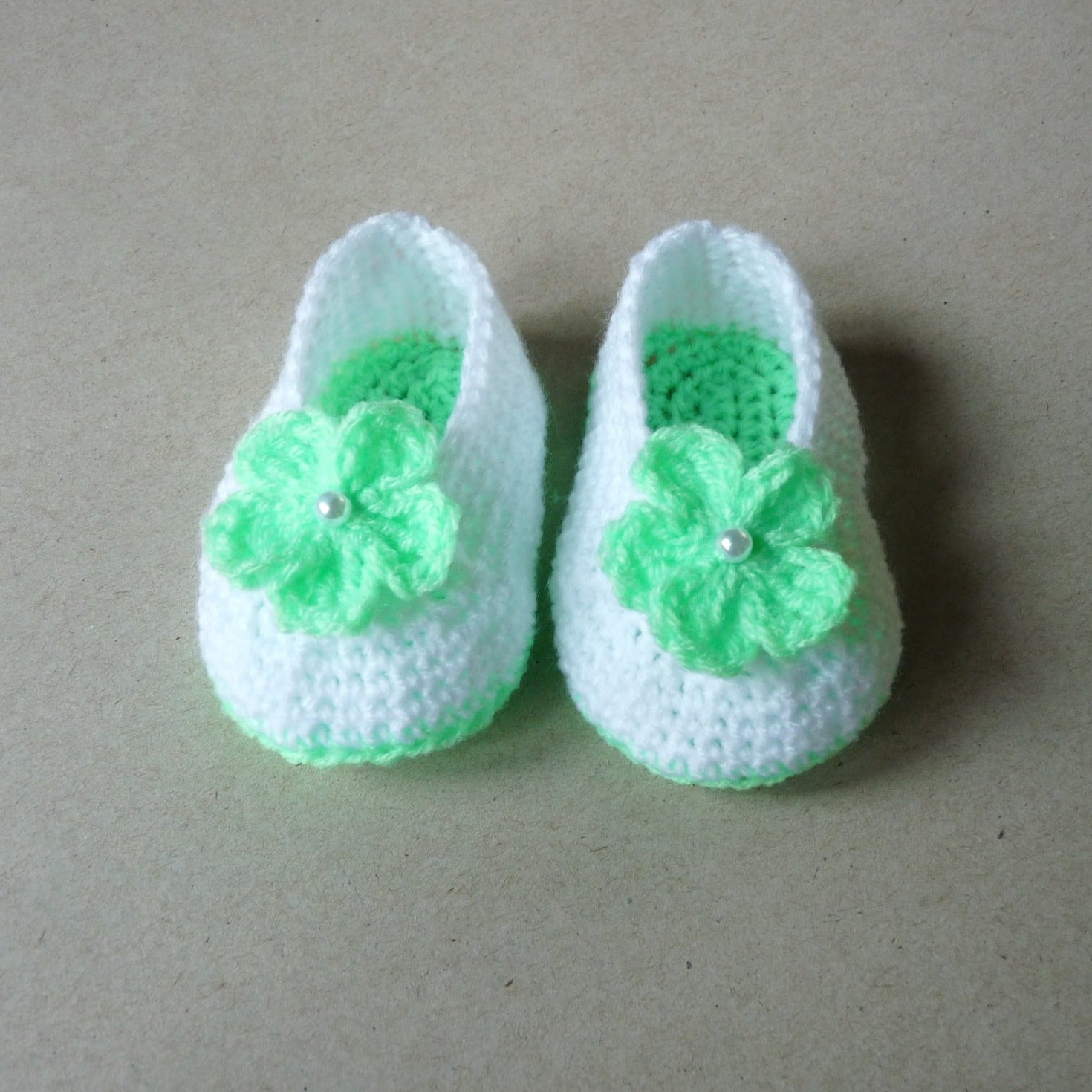 light green and white crochet baby shoes with flowers for girls