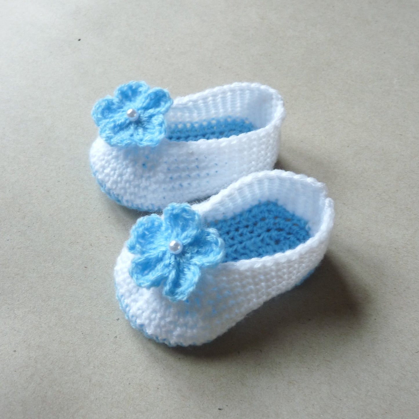 light blue and white crochet baby shoes with flowers for girls