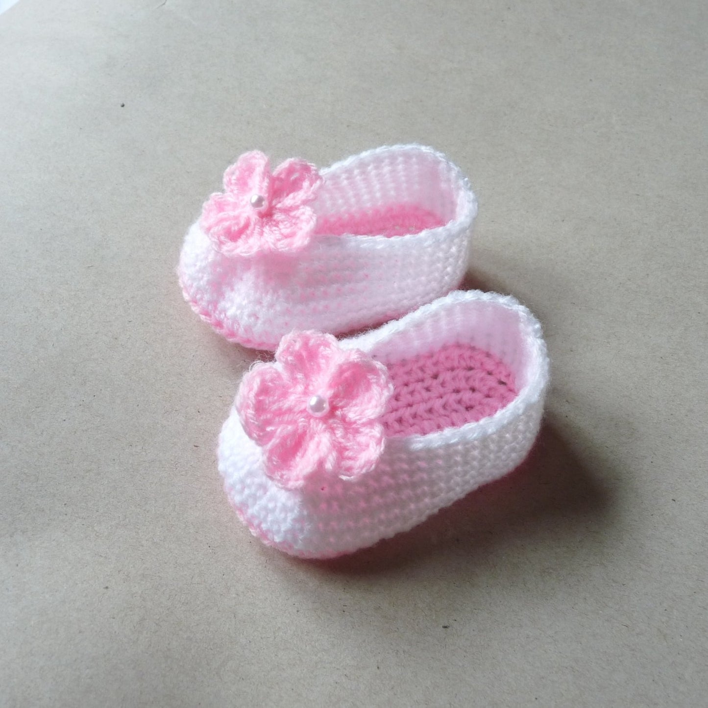 light pink and white crochet baby shoes with flowers for girls